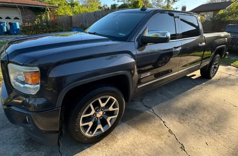 Glossy dark blue truck surface after advanced paint correction, removing imperfections and creating a mirror-like finish by Phantom Mobile Detailing in Jacksonville, FL